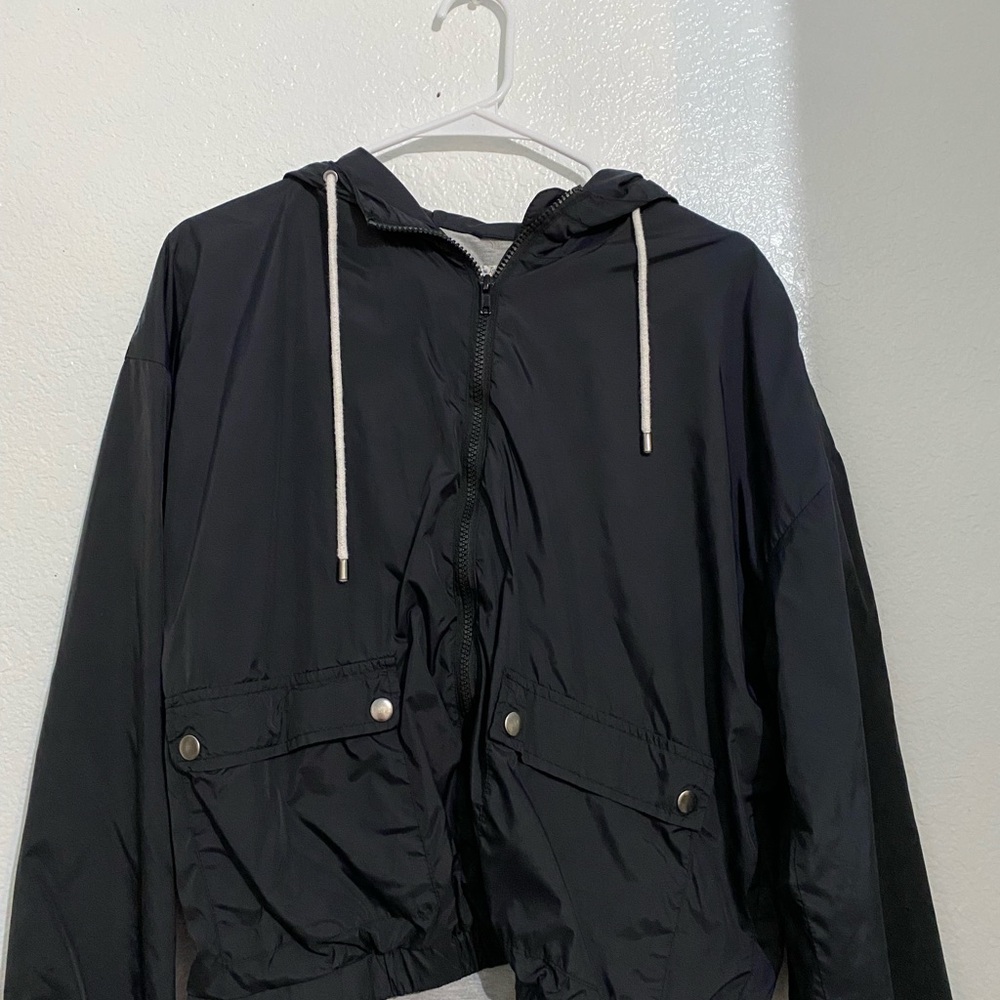 black windbreaker